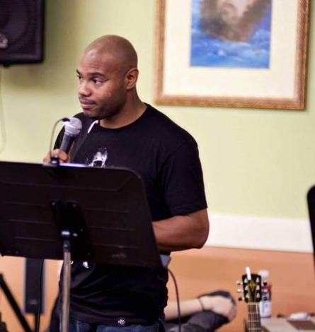 Pastor Eugene Taylor speaking at a community event